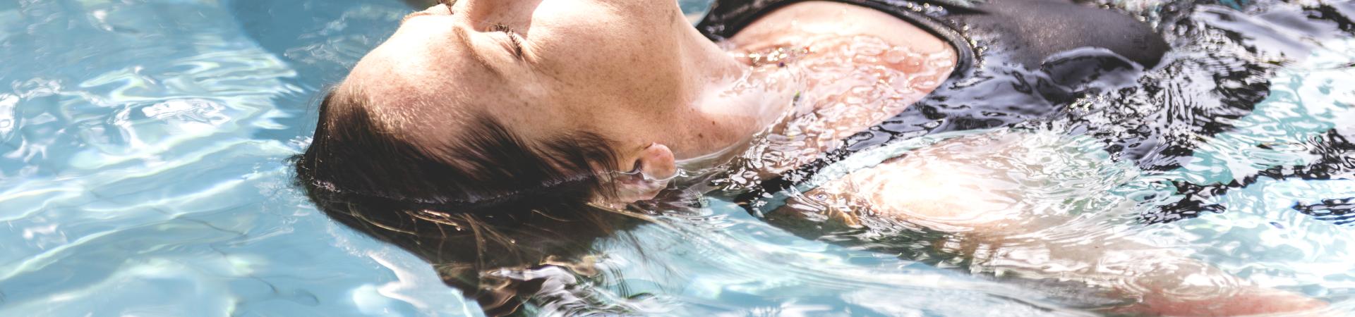 woman-enjoying-water-swimming-pool